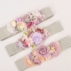 Cinturón de flores tono lila malva