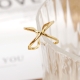 Anillo de acero ajustable X DORADO